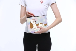 Detail of purple Corgi print toiletry bag with zipper closure and soft fabric texture