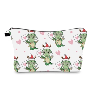 Détail de la trousse de maquillage de Noël blanche avec imprimé dragon vert festif