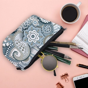 Detailed view of water-resistant toiletry bag with blue mandala pattern and zipper