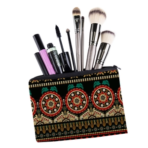 Close-up of mandala print toiletry bag with cosmetics showing its storage capacity