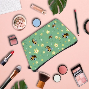Waterproof travel makeup bag with cute bee and floral print in mint green with zipper
