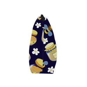 Detail shot of navy blue water-resistant cosmetic bag with bee and honey prints