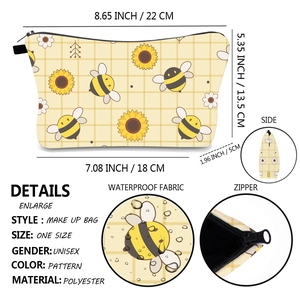 Detail of yellow bee print makeup bag showing waterproof fabric and size dimensions