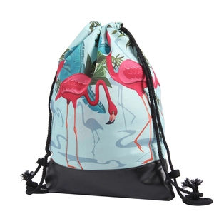 Detail view of bird print drawstring bag with reinforced PU leather bottom and thick cords