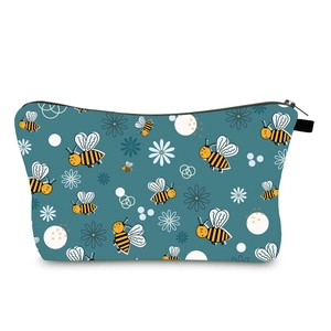 Detailed close-up of water-resistant makeup bag featuring cute bee and daisy print patterns