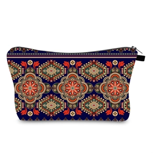 Detail of bohemian mandala print cosmetic bag with secure top zipper and navy blue base