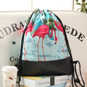 Light blue drawstring backpack with flamingo prints and black PU leather base for women