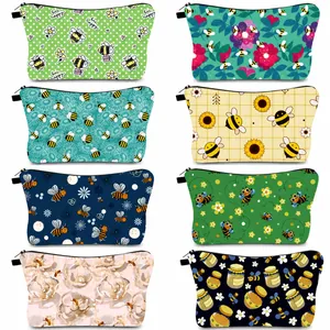 Waterproof bee print makeup bags in multiple colors and patterns with zip closure