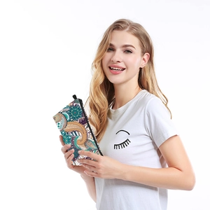 Waterproof mandala print cosmetic bag held by a model for travel organization