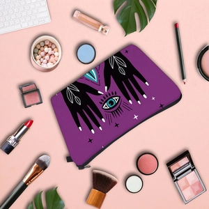 Purple waterproof cosmetic bag with Evil Eye print and zipper closure for travel