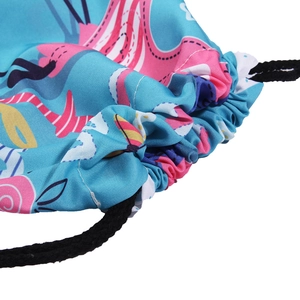 Blue drawstring bag with cute pink flamingo prints and durable black braided cords