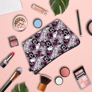 Detailed top view of travel toiletry bag with skull and purple tulip floral patterns