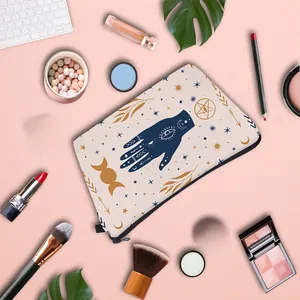 Detailed flat lay of an Evil Eye cosmetic bag with mystic Hamsa and celestial patterns