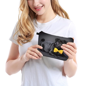 Close-up of waterproof cosmetic bag featuring a cute pug print with yellow bow tie