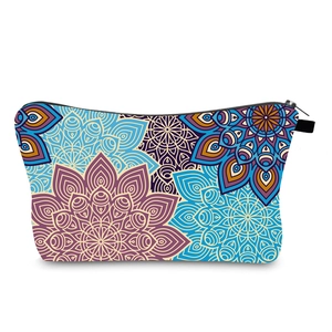 Detailed close-up of bohemian mandala floral print on waterproof travel makeup bag