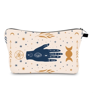Detail of waterproof Evil Eye makeup bag with Fatima hand, moon and star patterns