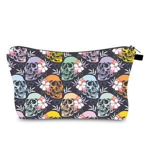 Detail of waterproof makeup bag featuring vibrant pop-art skull and floral patterns