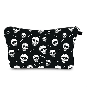 Detail of waterproof makeup bag with heart-eye skull patterns and black zipper closure