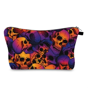 Close-up of a waterproof organizer bag with colorful graffiti skull pattern and zipper