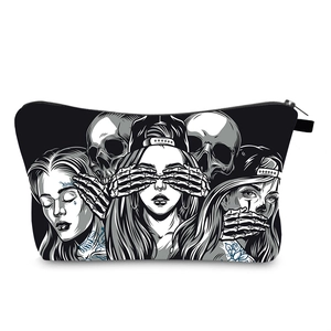 Detail of waterproof cosmetic bag with skull and tattoo girl print and metal zipper