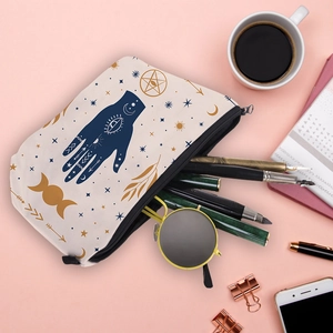 White canvas cosmetic bag with Evil Eye print and bohemian symbols for makeup storage