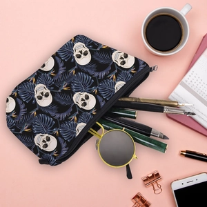 Interior detail of skull floral cosmetic bag showing sunglasses and pens storage space