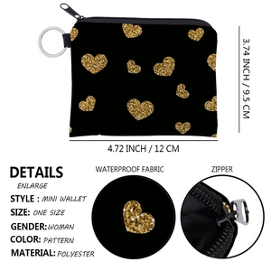 Detailed view of waterproof polyester coin purse with gold heart print and size specs