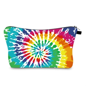 Detailed close-up of rainbow tie-dye pattern on flat rectangular travel makeup pouch