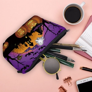 Halloween theme purple makeup bag with festive prints and zipper on pink desk setup