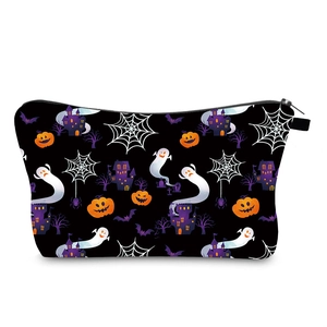 Detailed macro view of Halloween digital print makeup bag with ghosts and pumpkins