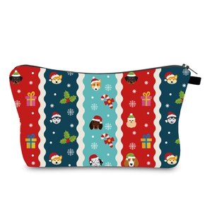 Detail of waterproof Christmas makeup bag showing festive dog prints and zipper closure