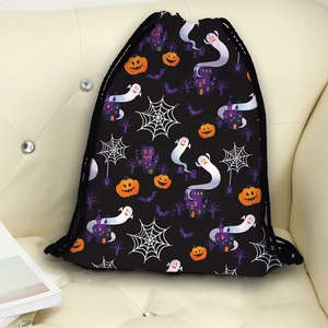 Waterproof Halloween drawstring bag featuring pumpkins, ghosts and castles on beige sofa