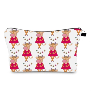 Detail of waterproof makeup bag featuring cute cartoon cow print and black metal zipper closure