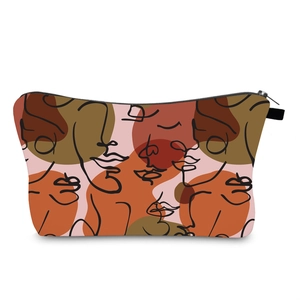 Detail view of water-resistant toiletry bag with abstract line art facial print