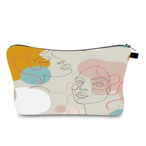 Detail view of water-resistant toiletry bag with modern female face line art and black zipper