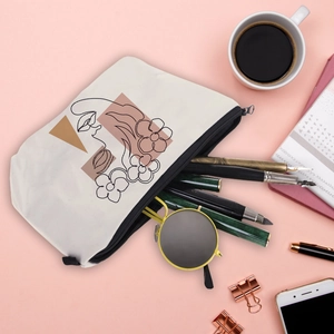Waterproof travel toiletry bag with minimalist artistic portrait and floral prints