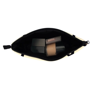 Waterproof toiletry bag with PSSST print, cream canvas material for travel storage