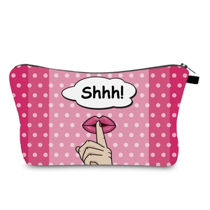 Detailed pink polka dot makeup bag featuring pop art lips and Shhh! illustration detail