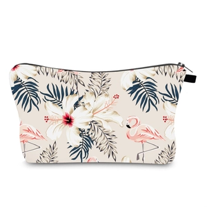 Close-up of water-resistant travel bag with pink flamingo and tropical floral print
