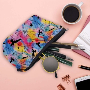 Waterproof toiletry bag with dandelion print and black birds on a light pink background