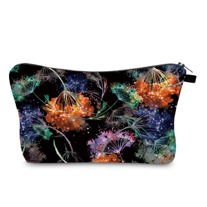 Detail of waterproof toiletry bag with vibrant dandelion digital floral print and zipper