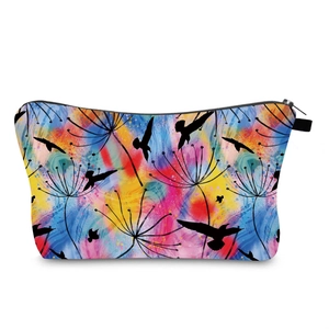 Detail view of water-resistant toiletry bag with vibrant artistic dandelion and bird print