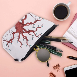 Water-resistant travel makeup bag with Tree of Life print and black zipper closure