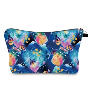 Detail of waterproof makeup bag featuring fantasy watercolor firefly and star pattern