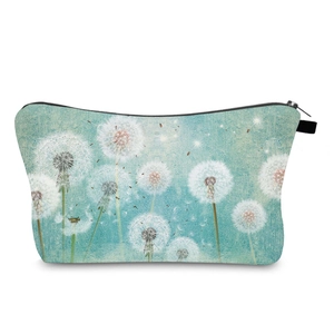 Detailed view of dandelion print on waterproof travel toiletry bag with black zipper