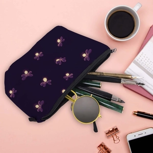 Purple waterproof travel pouch with firefly print holding sunglasses and pens