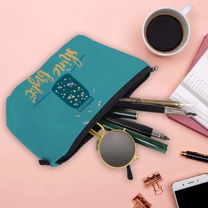 Waterproof blue canvas makeup bag with Shine Bright print for travel storage