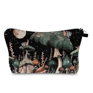 Detailed view of mushroom and snail pattern on a digital print portable makeup bag