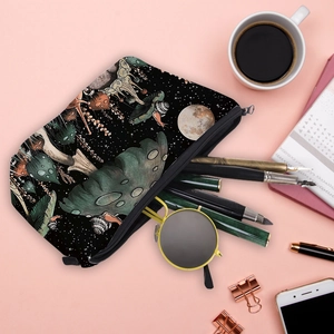 Portable makeup bag with colorful mushroom prints and zipper closure on a desk