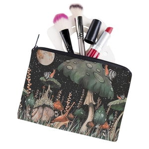 Square black makeup bag with colorful mushroom and snail forest print for travel